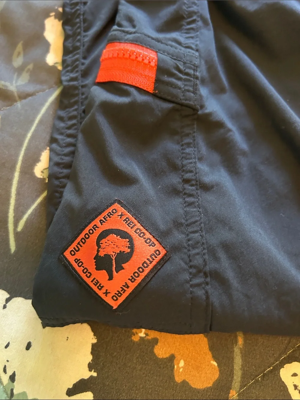 REI Men's Black Outdoor Softshell Pants with Orange Zip Accents
